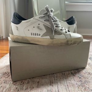 Golden Goose Super Star Classic white leather, black heel with fabric star.